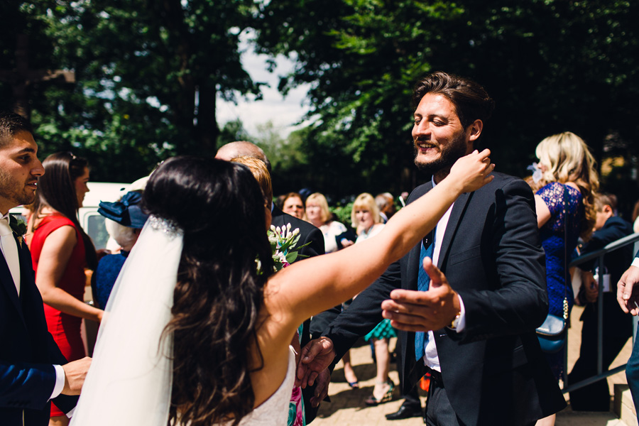 guests celebrate with bride - shot by Courteen Hall wedding photographer