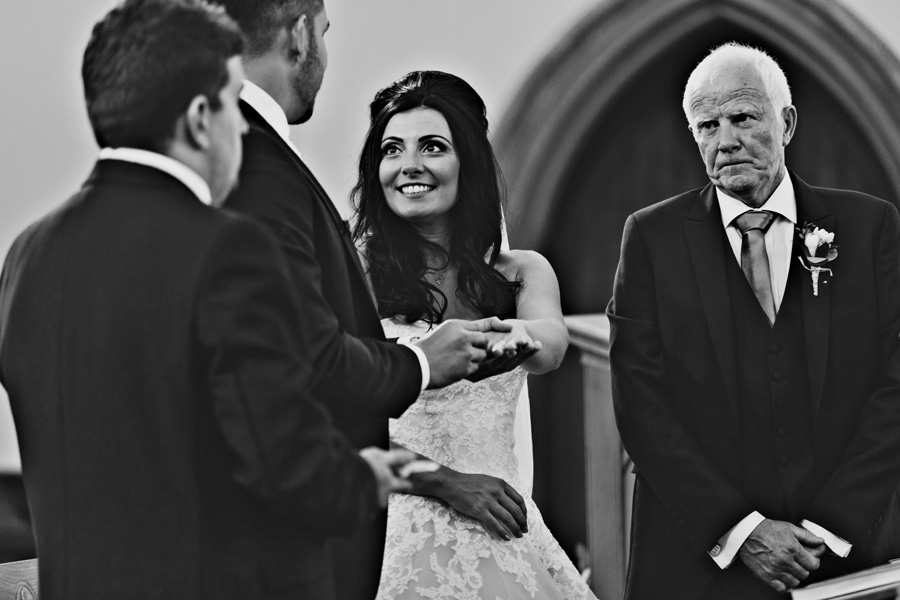 bride and groom taking their vows - captured y Courteen Hall wedding photographer