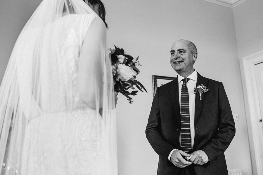 reportage photography of father and bride, shot by Dodford Manor wedding photographer