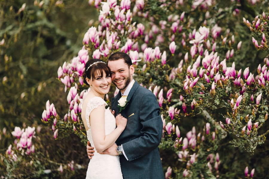 a smiling bride and groom