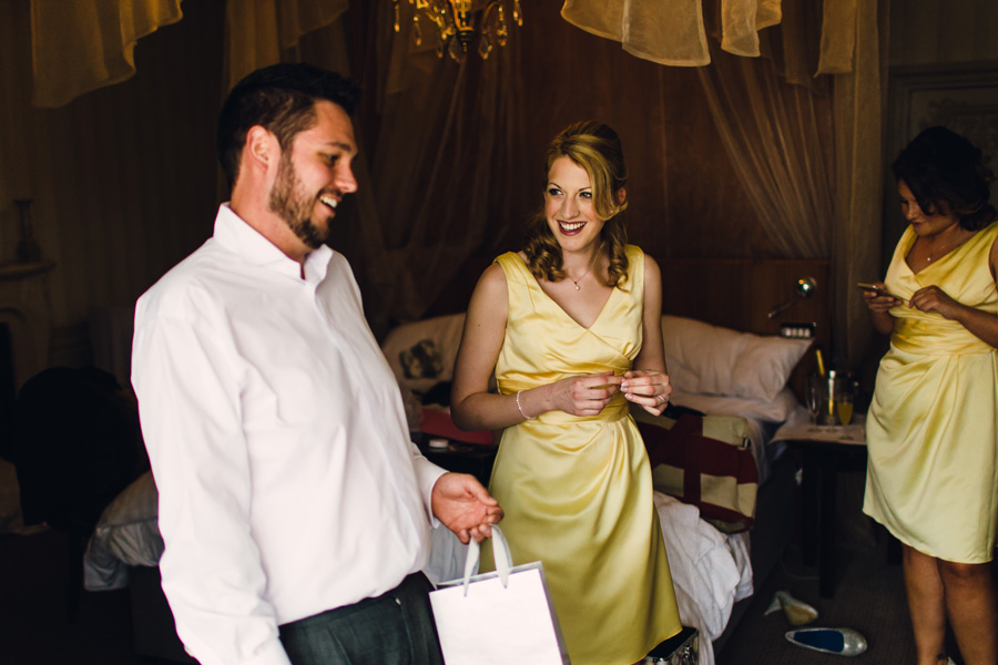 A bridesmaid wearing a yellow bridesmaids dress