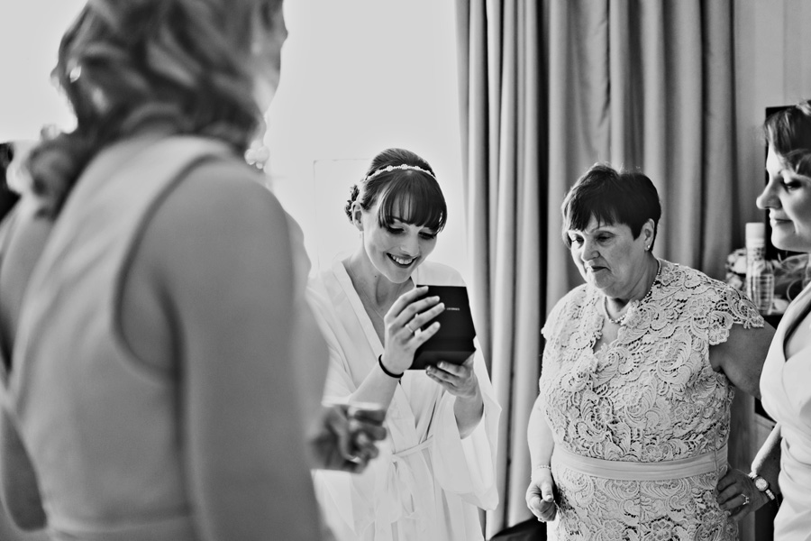 a bride receives a wedding present from the groom