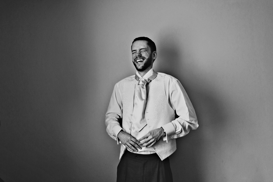 a relaxed portrait of a groom