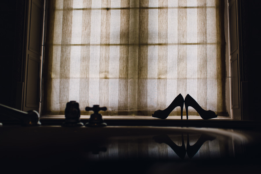 a silhouette of some wedding shoes