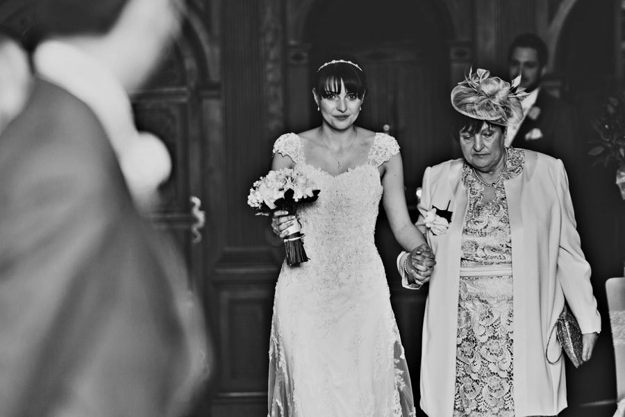 a bride walks down the aisle