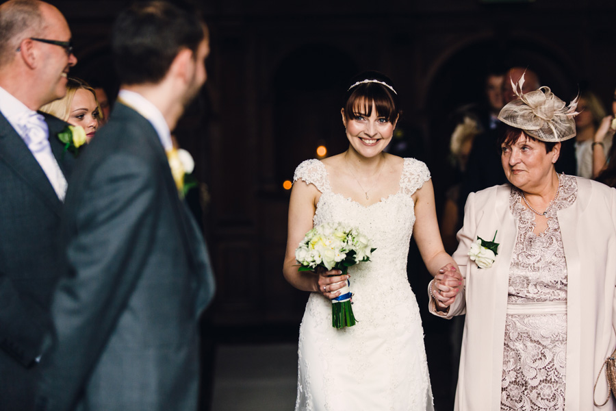 a bride smiles at her groom