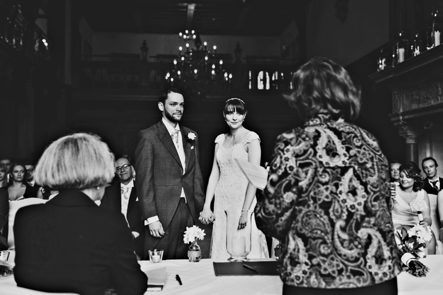 a black and white photograph of a wedding ceremony