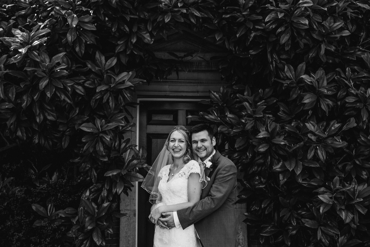 a smiling bride and groom