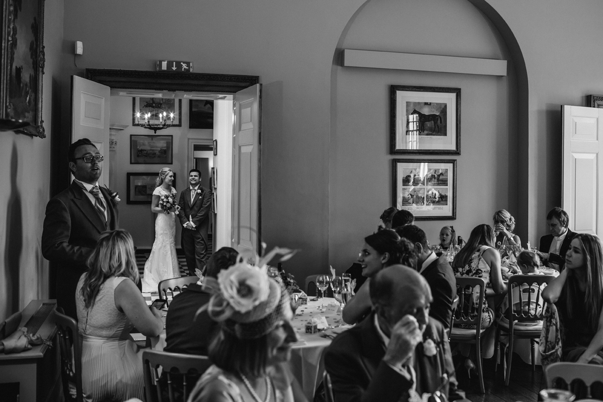 a bride and groom waiting to be announced