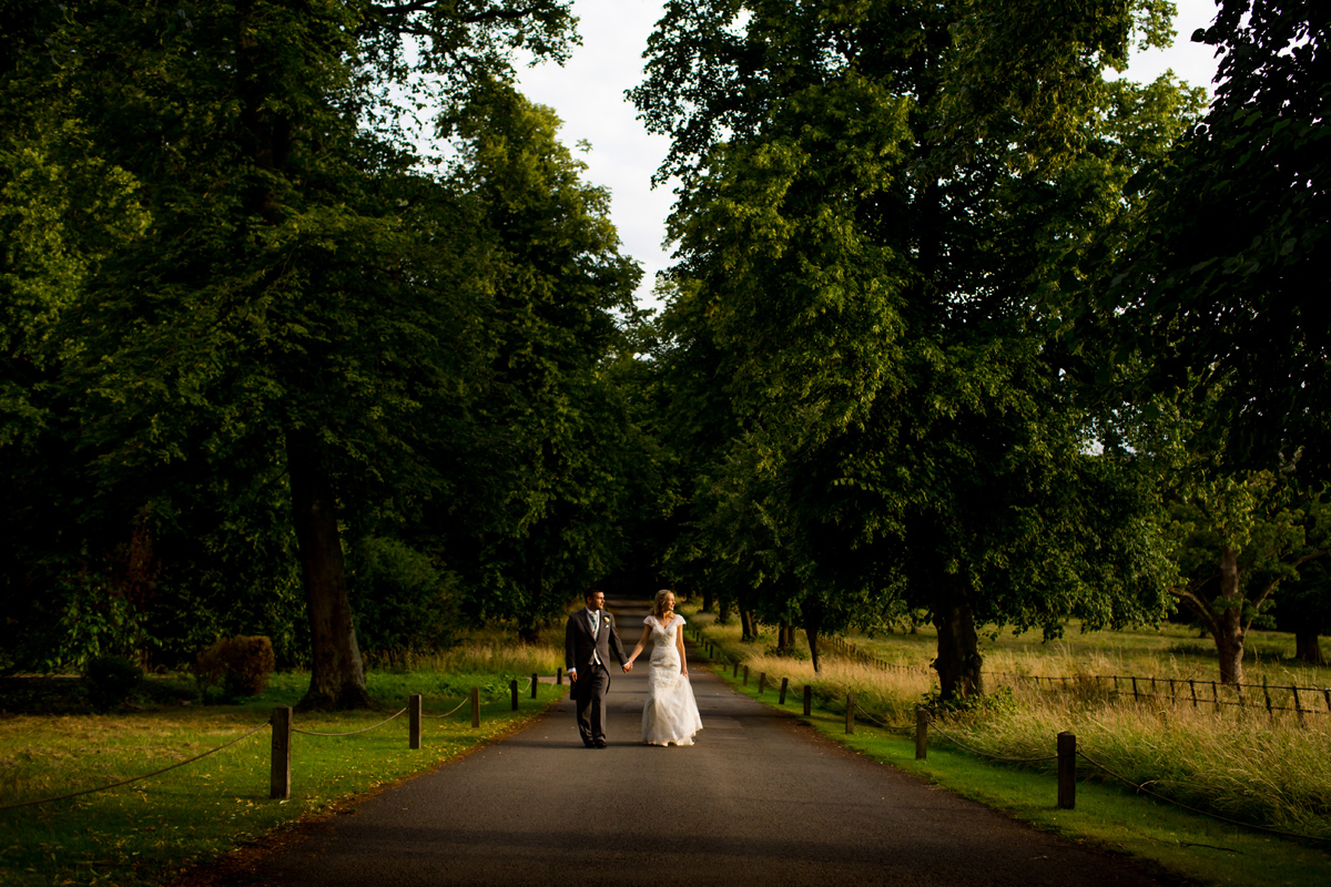 Northamptonshire wedding photographer captured by Elliot W Patching. Bride and groom on country lane.