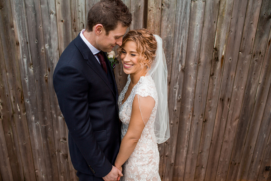 groom and bride embrace each other - photographed by reportage wedding photographer - Elliot W Patching