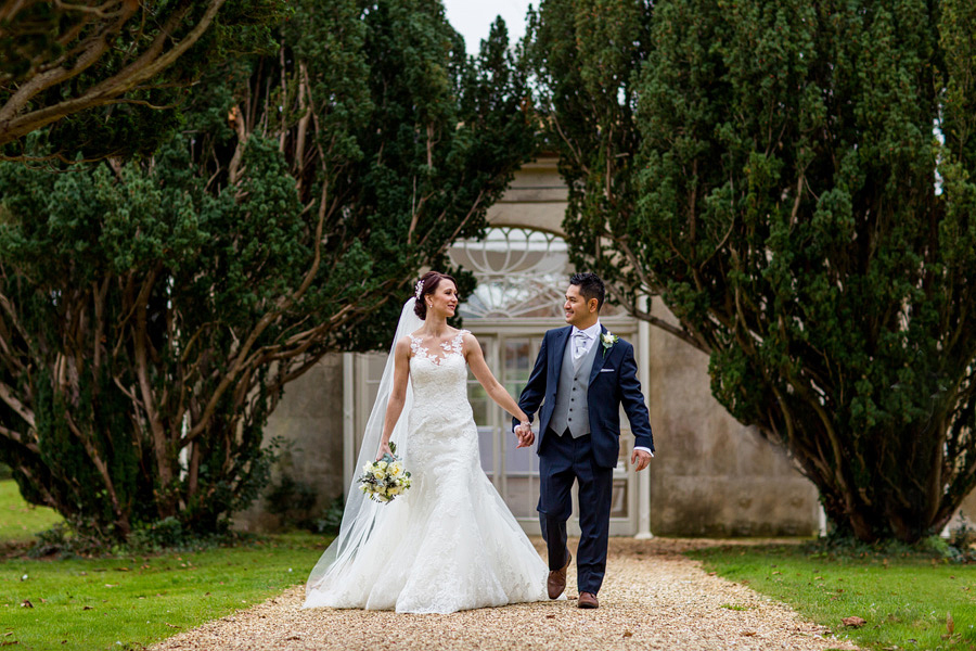 a bride and groom taking a walk