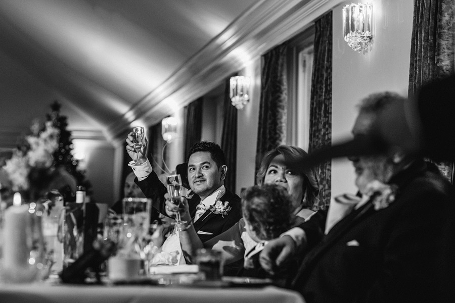 a black and whit photograph of a wedding speech