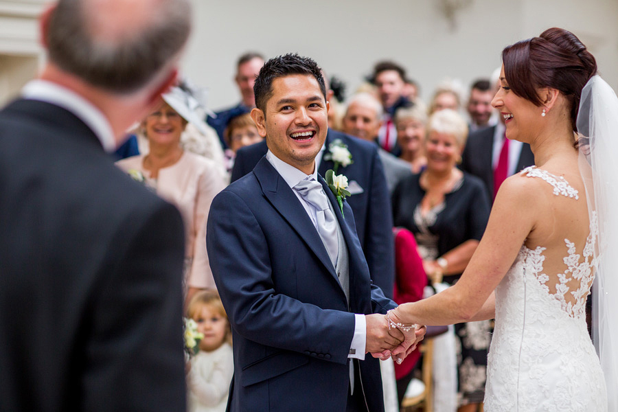 Laughing during a wedding ceremony
