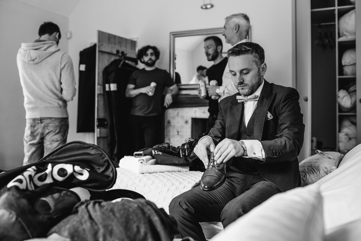 the groom prepares for his wedding