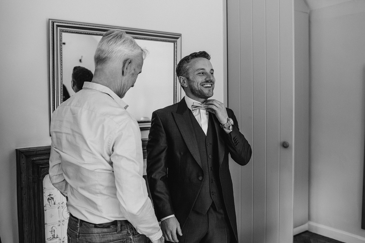 a smiling and happy groom