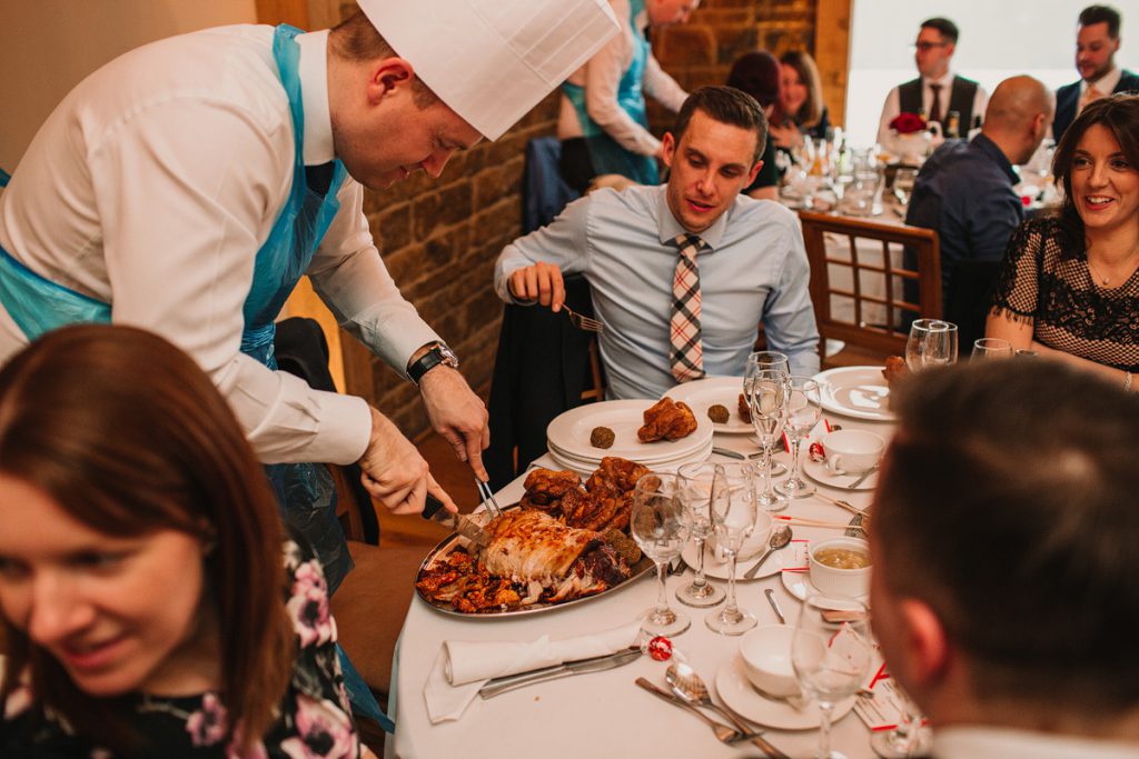 a guest cuts the meat at a host the roast