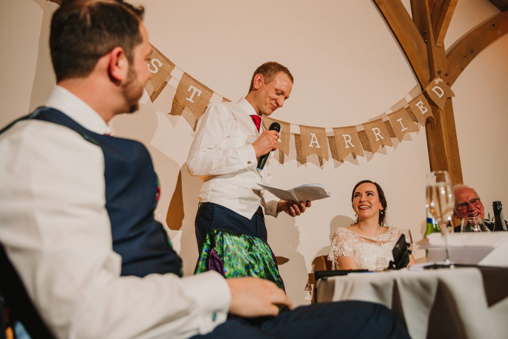 the groom delivers his wedding speech