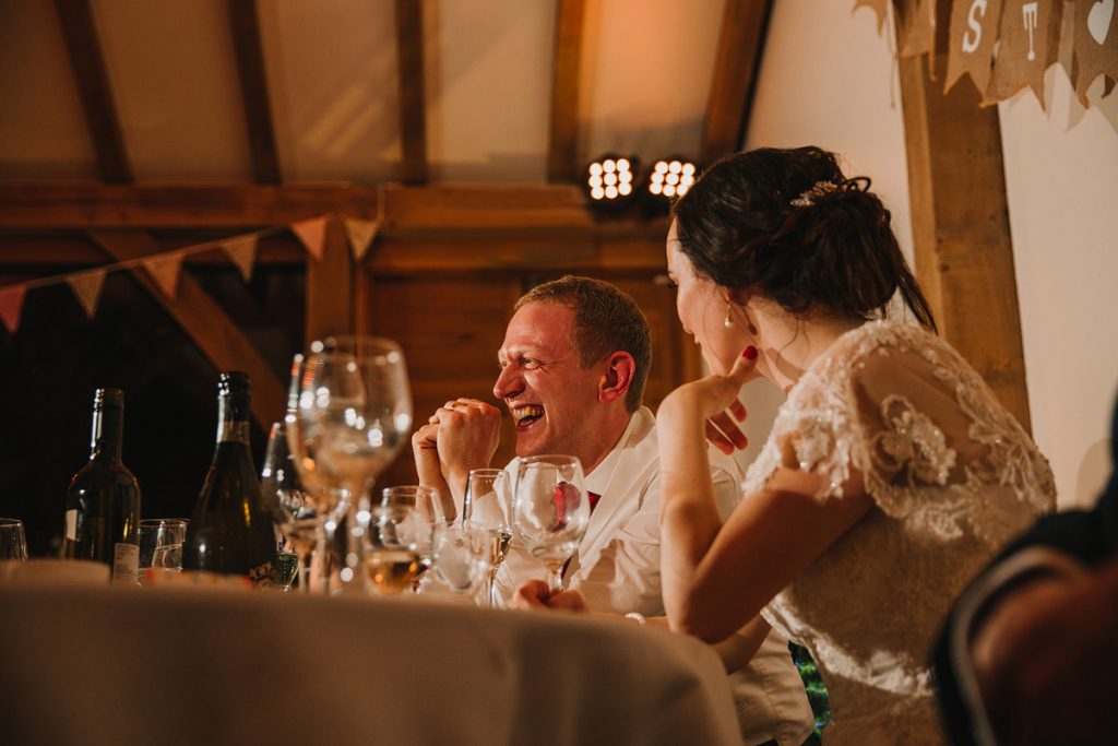 a laughing groom on his wedding day