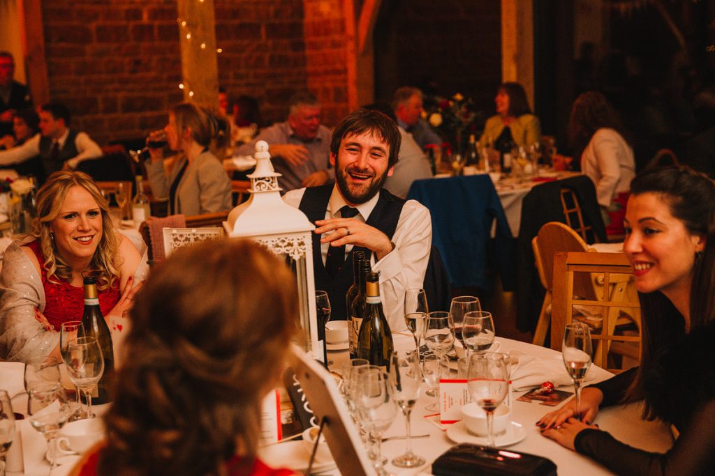 a guest laughing at a wedding