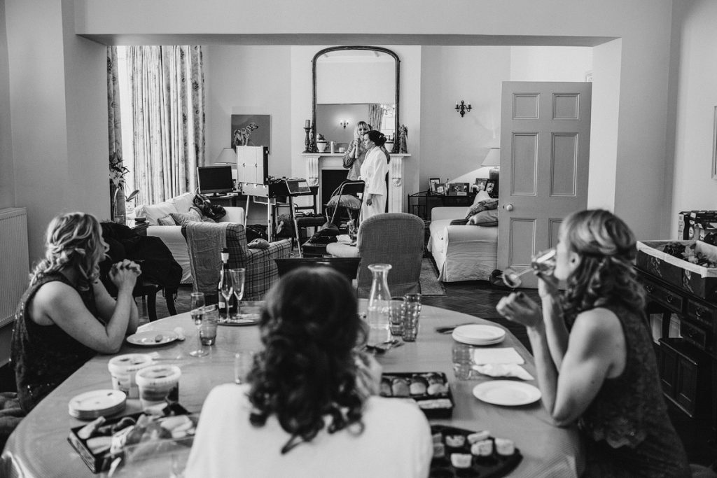 a black and white photograph of the morning of a wedding