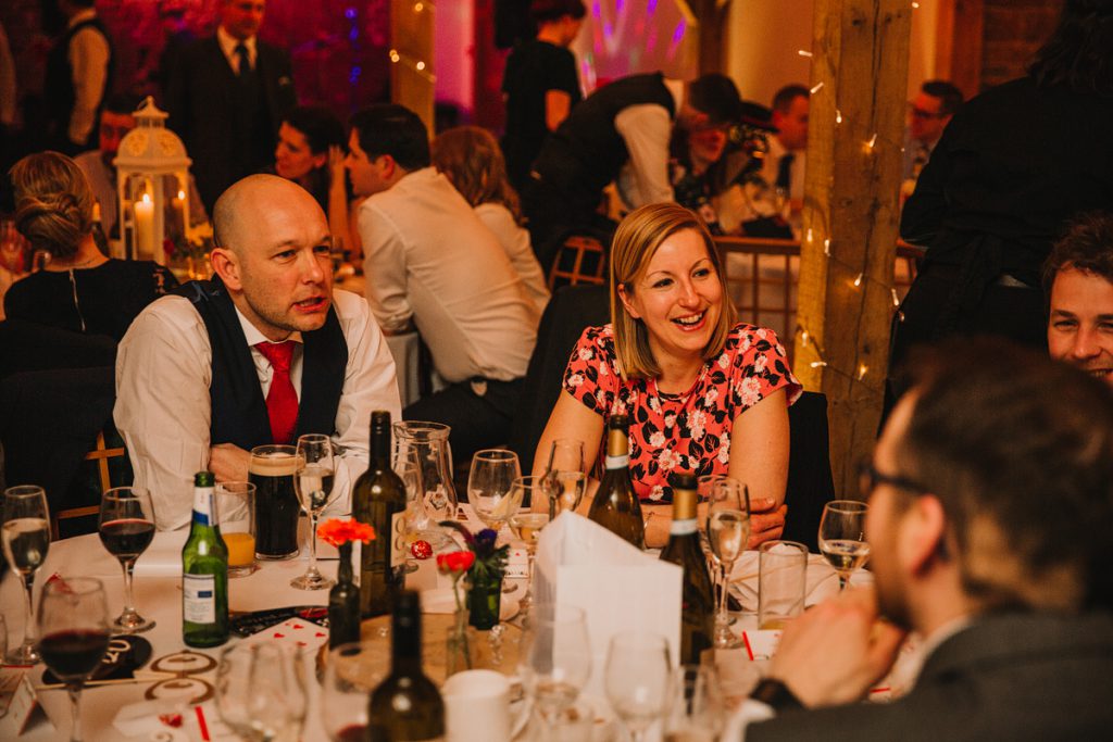 smiling guests enjoy a wedding