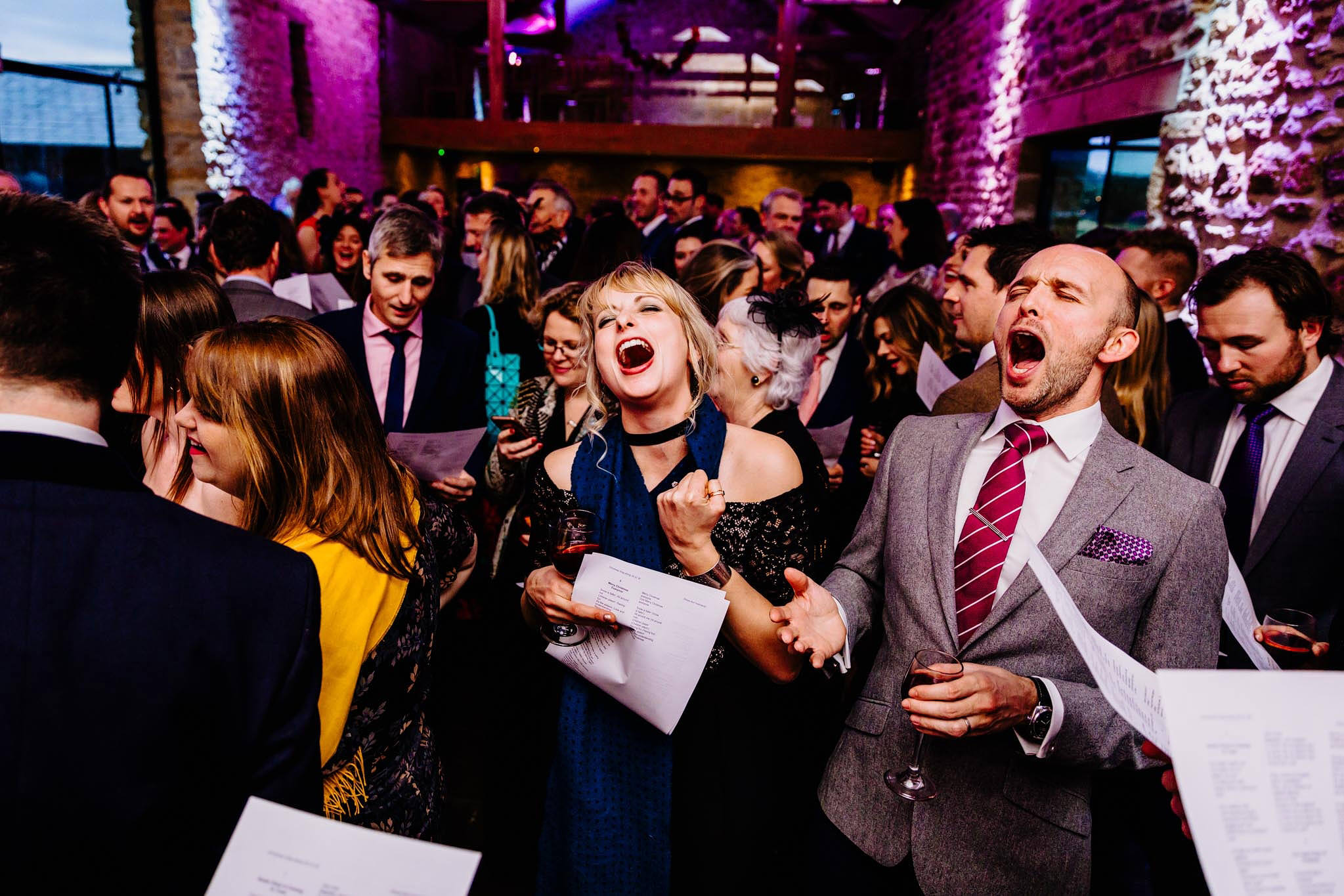 wedding guests singing carols