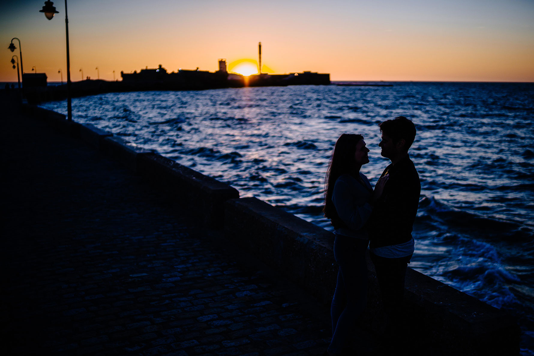 a silhouette photograph at sunset