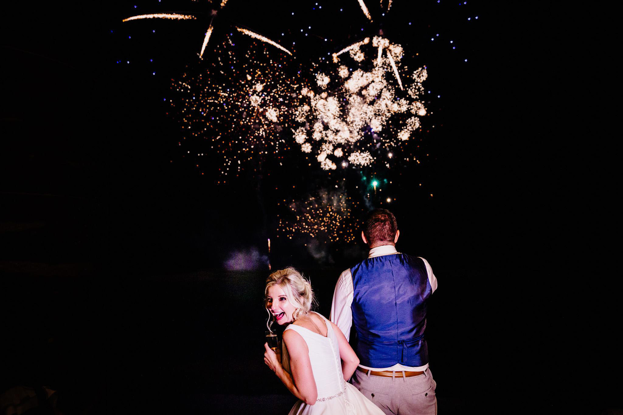 a happy bride enjoying fireworks