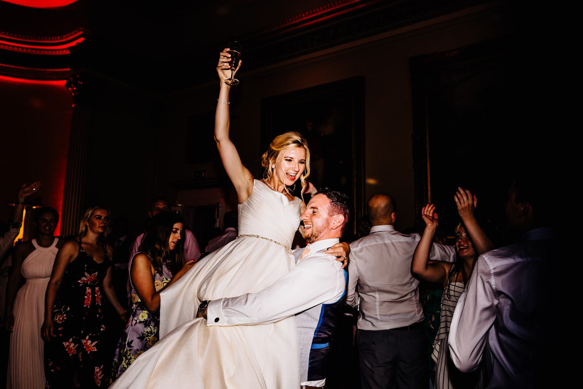 a groom lifting his bride