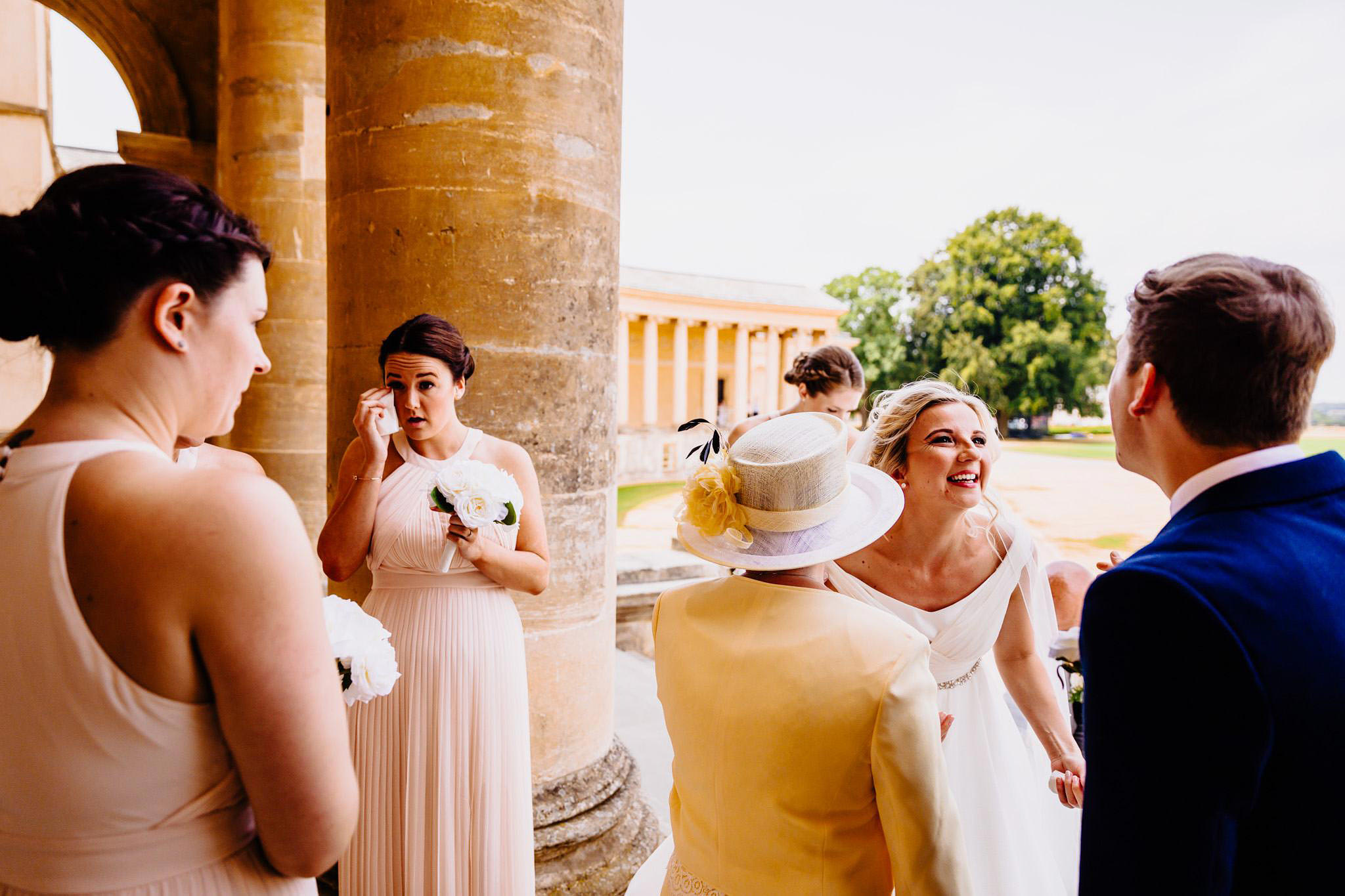 a bride shares a joke with her brother