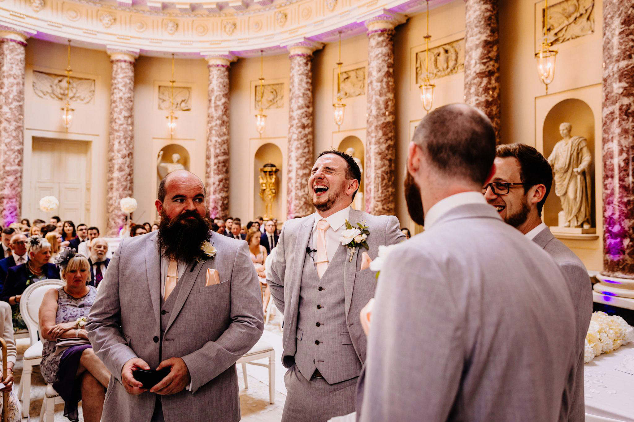 a groom laughing before getting married