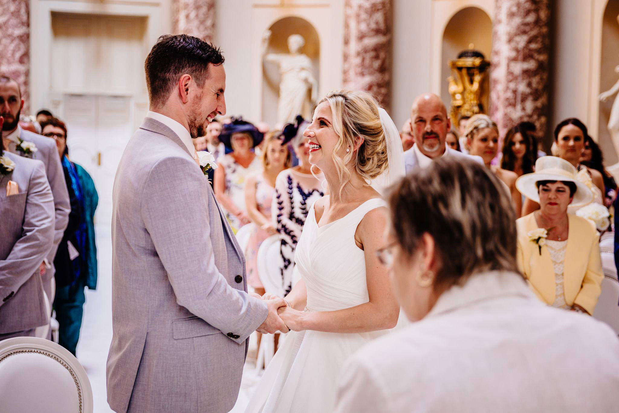 a bride and groom holding hands