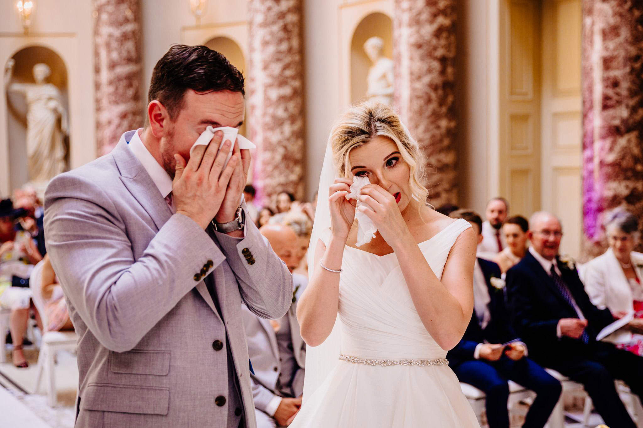 an emotional bride and groom