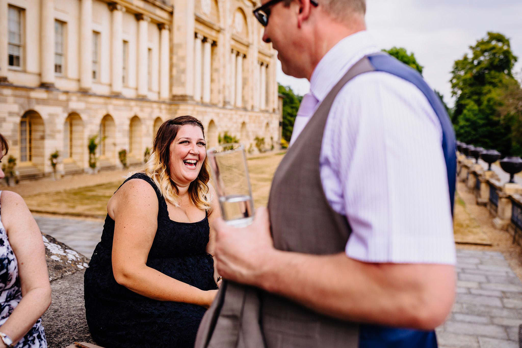 laughing wedding guests