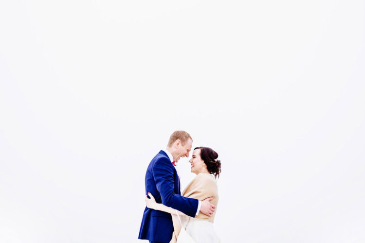 a bride and groom smiling