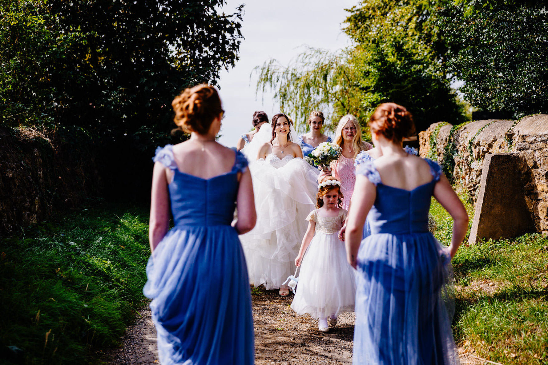 a bride walking to her wedding ceremony