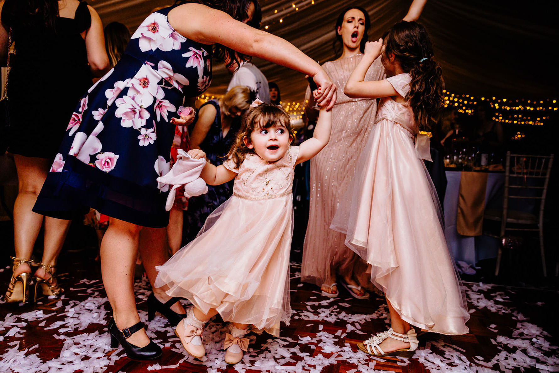 a smiling child at a wedding