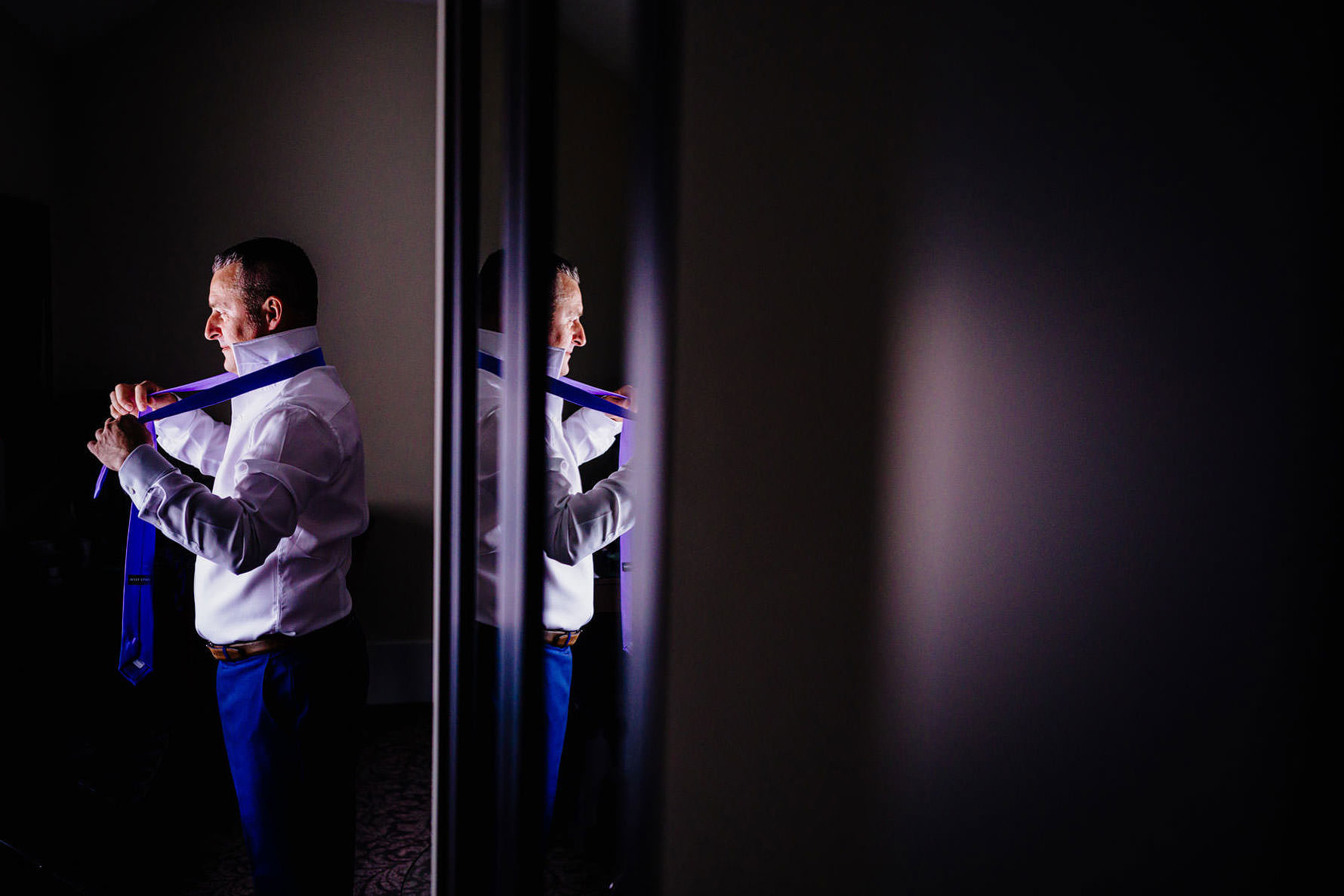 a reflection of a groom