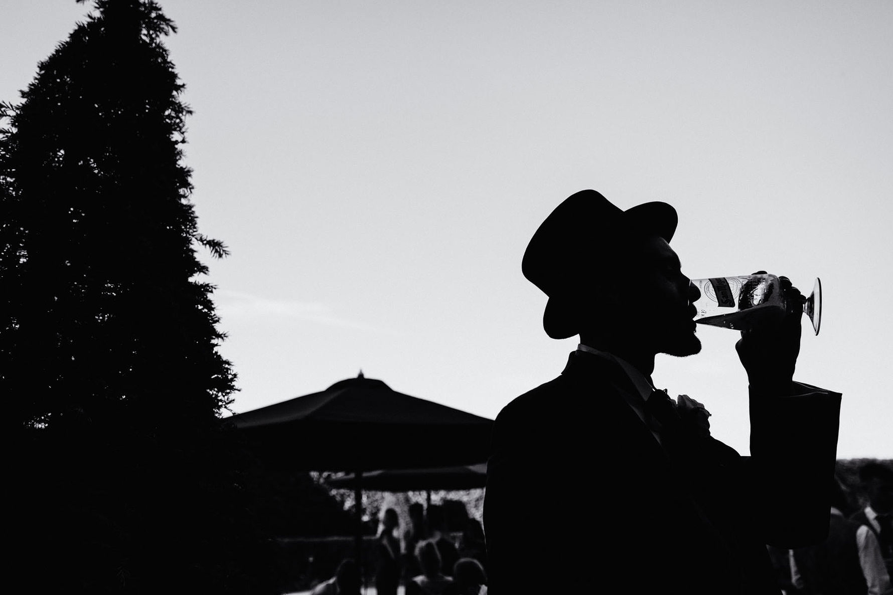 drinking beer at a wedding reception