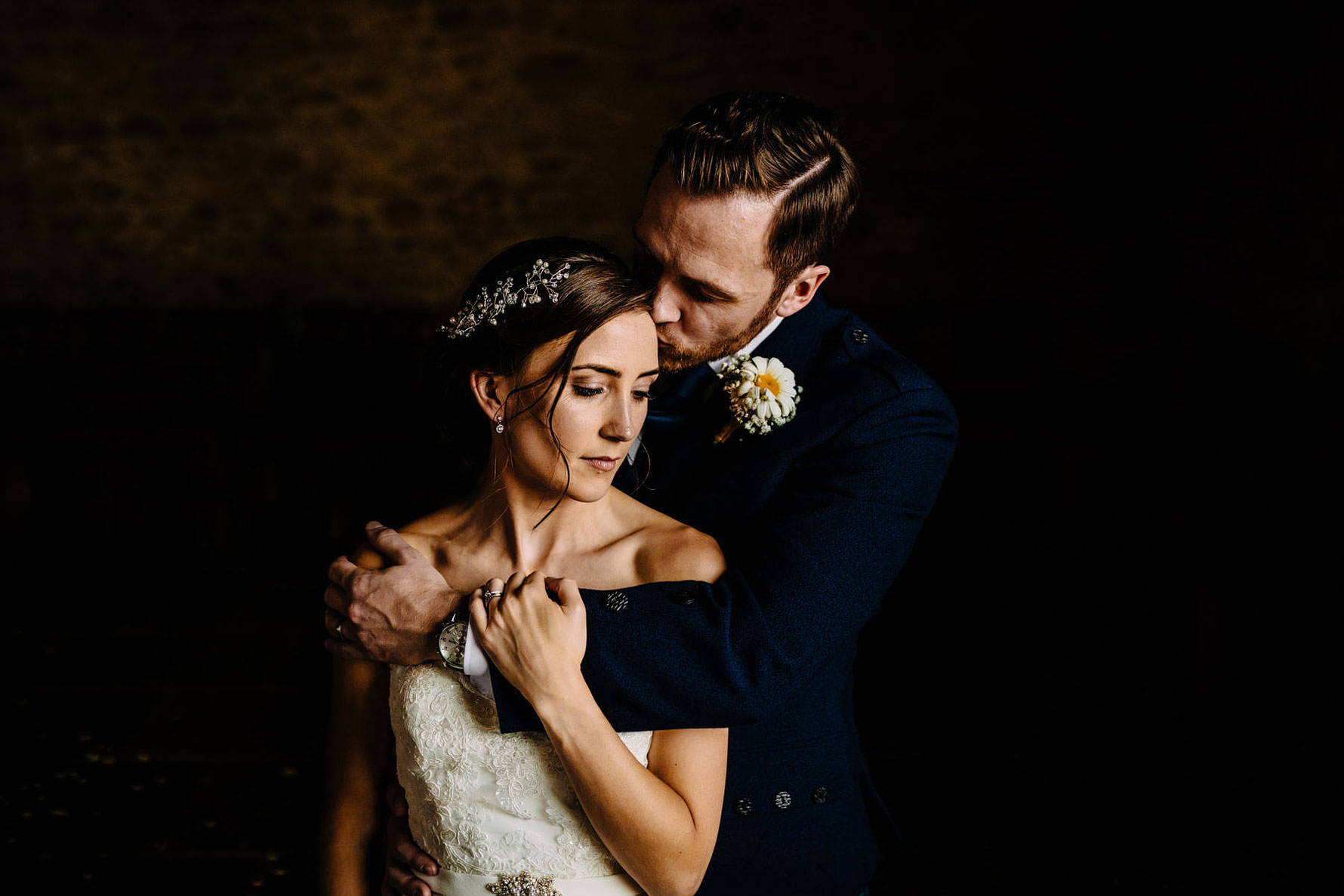 a tender moment between a bride and groom