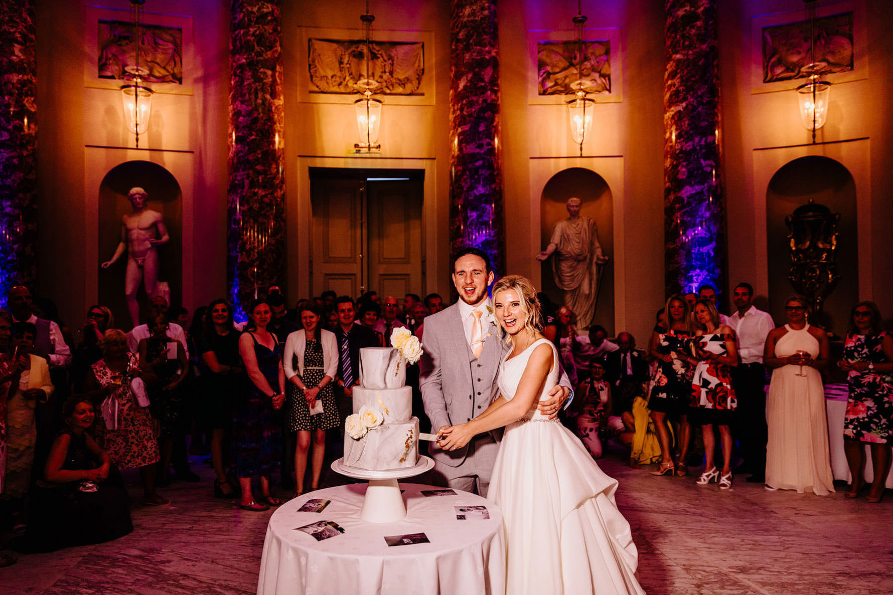 a bride and groom cake cutting