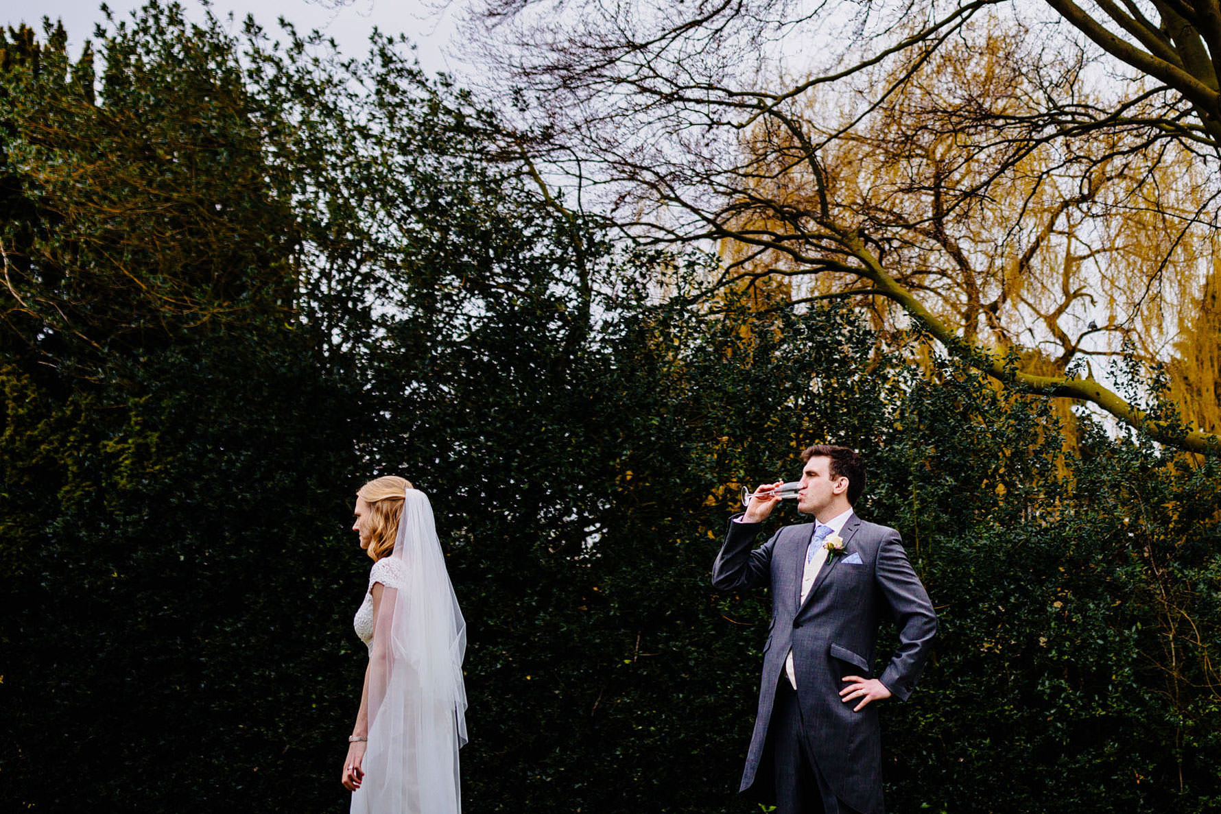 a groom drinking champagne