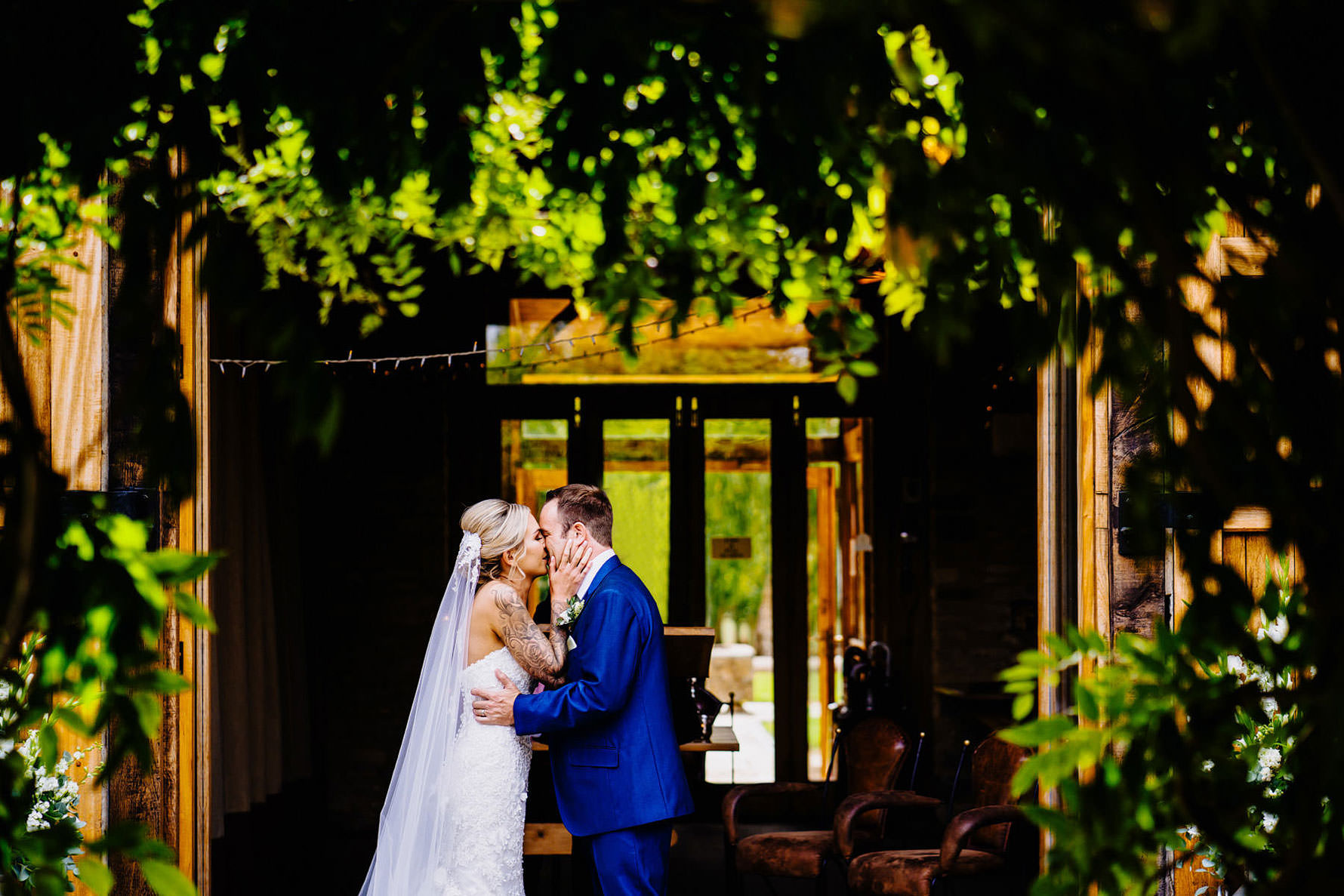 a first kiss between a bride and groom