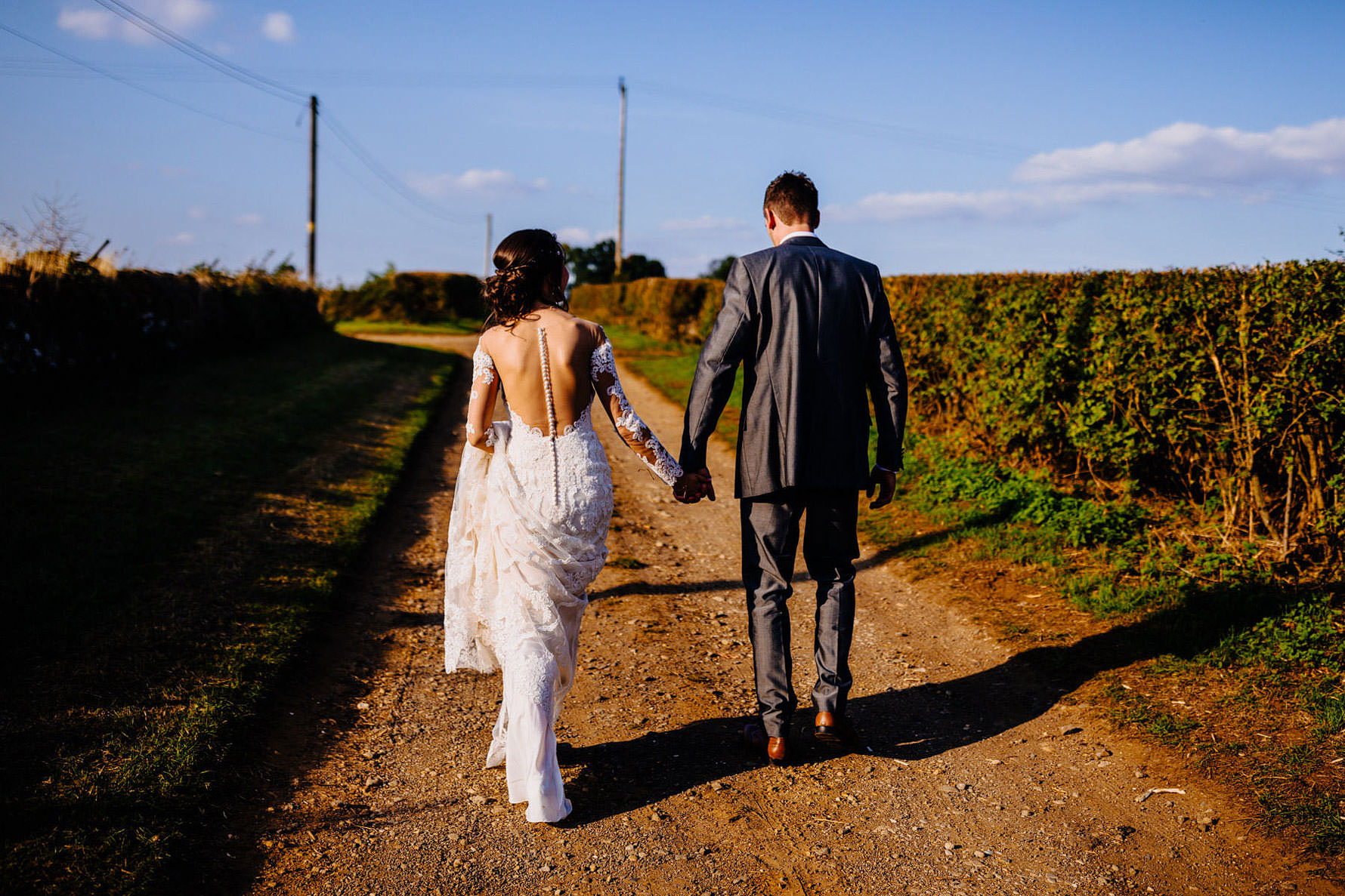 a bride and groom take a walk