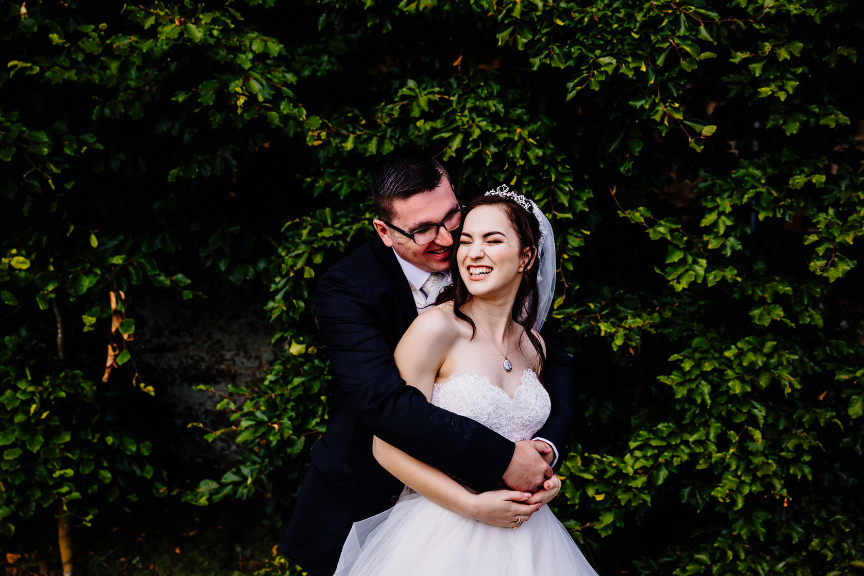 a bride and groom embrace