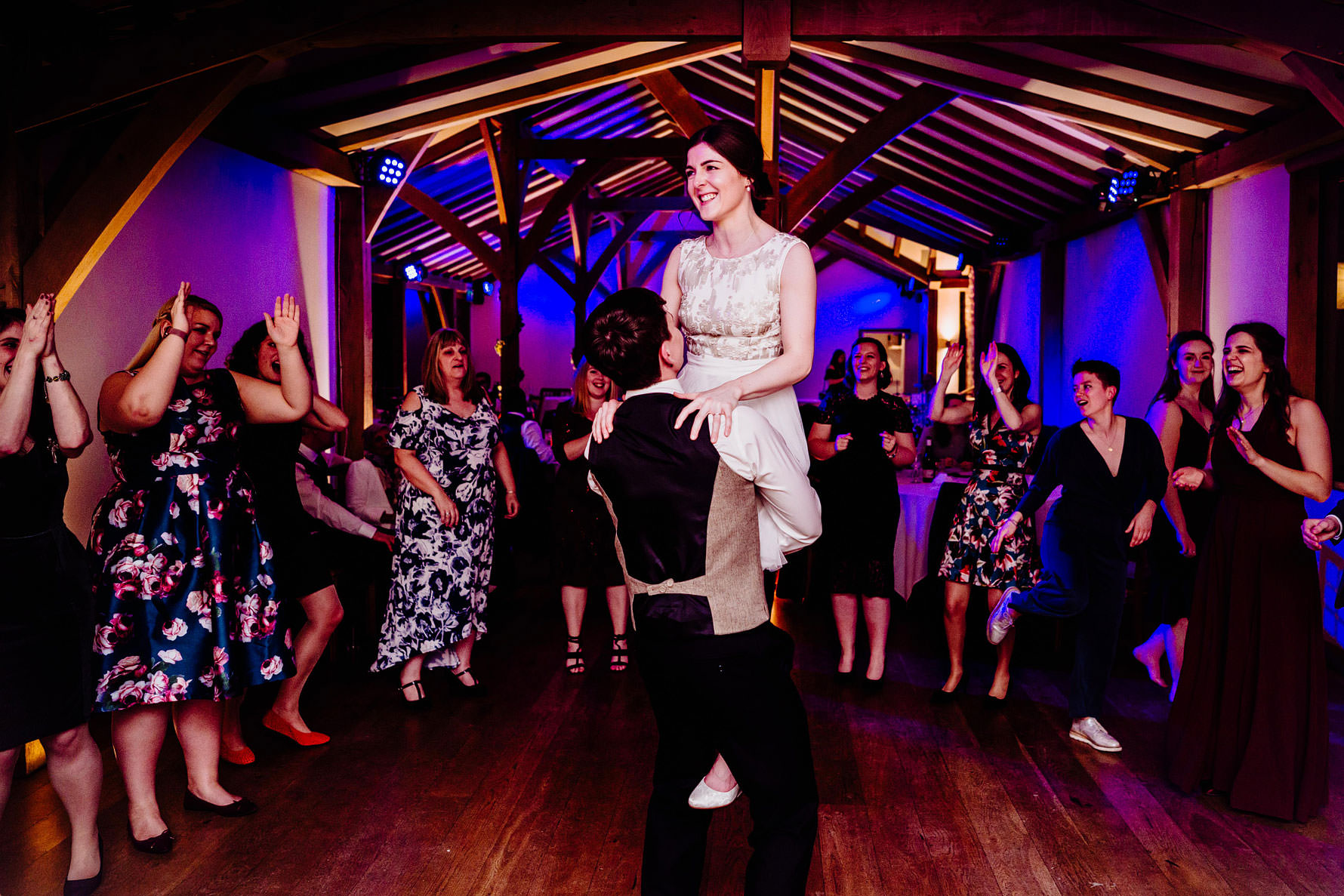 a bride is lifted aloft