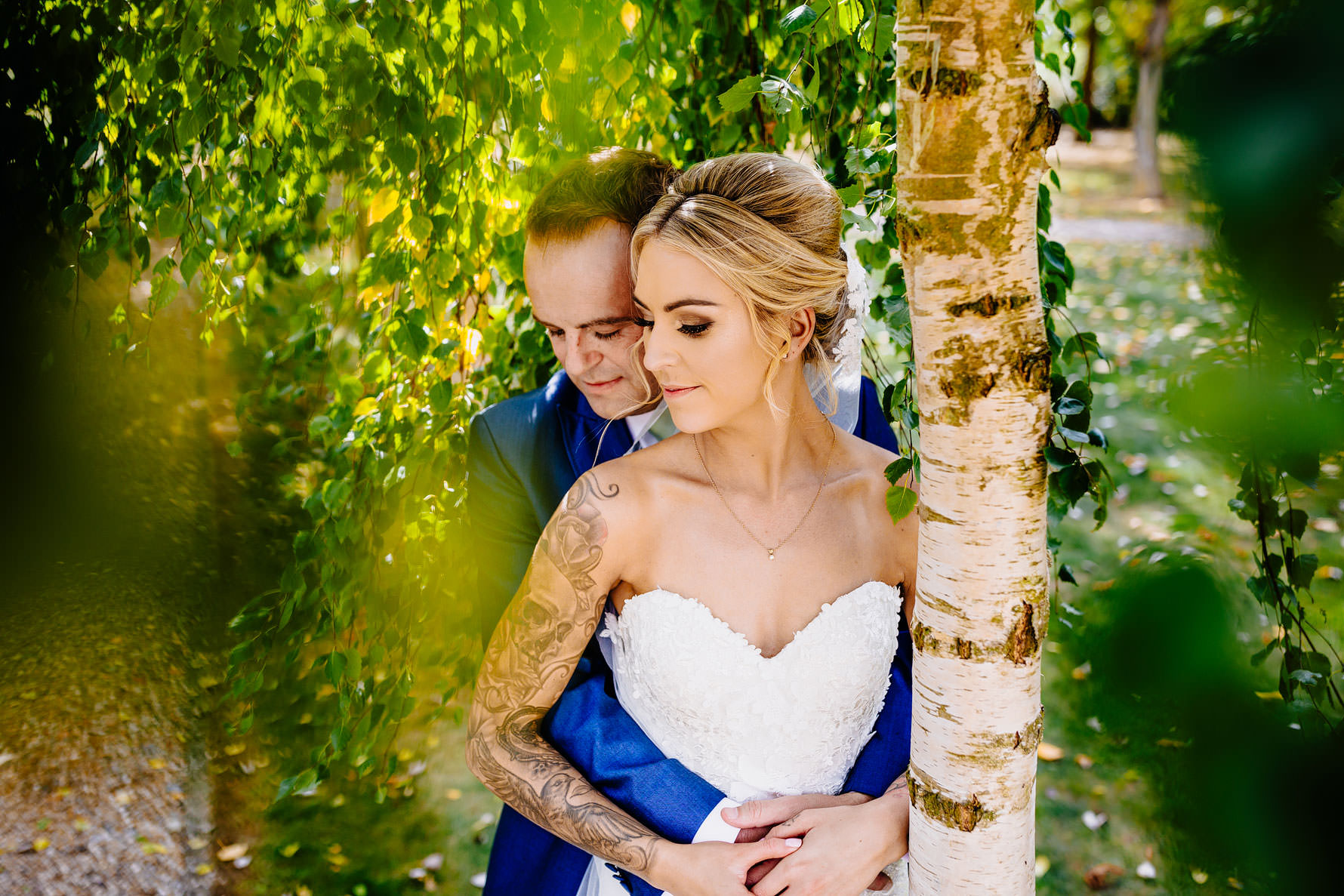 a bride and groom embrace