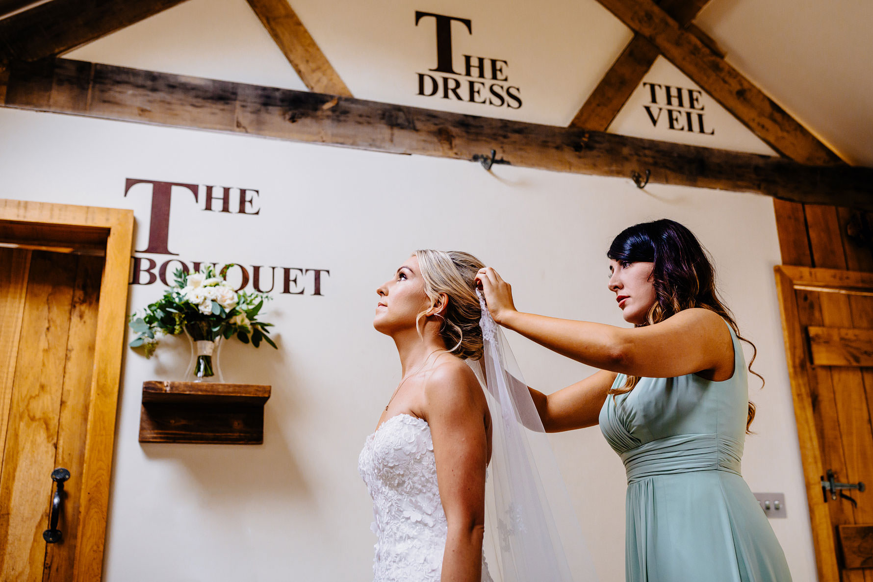 a wedding veil being fitted