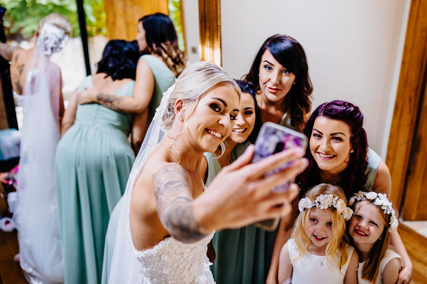 a bride taking a photograph